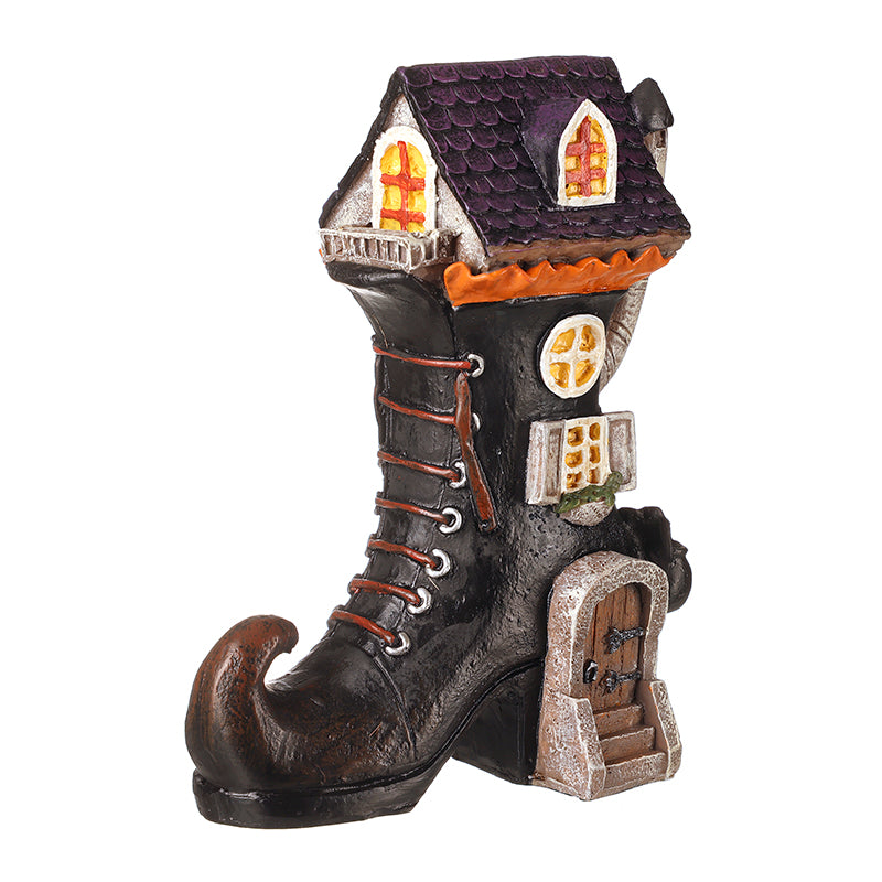 Black resin witch's boot house – Heaven Sends