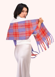Flora Cosy Scarf - Tangerine Mix by Powder spread across a model's shoulders