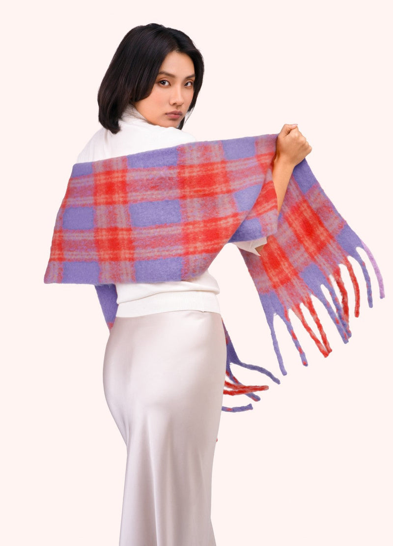 Flora Cosy Scarf - Tangerine Mix by Powder spread across a model's shoulders