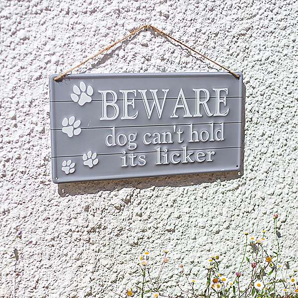 La Hacienda Embossed Sign "Beware Dog Can't Hold Its Licker"
