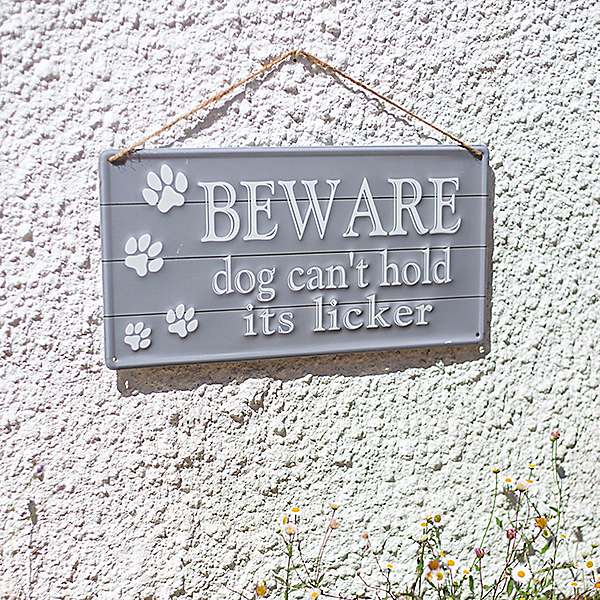 La Hacienda Embossed Sign "Beware Dog Can't Hold Its Licker"
