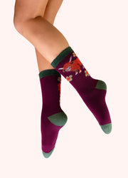 Highland Cow Cosy Socks - Purple by Powder worn on the leg