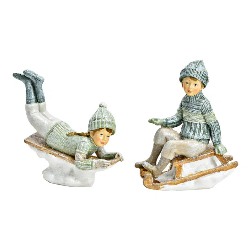 Winter Child on a Sledge, Boy or Girl 8x10x4cm Sold Individually